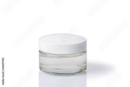 Cosmetic cream in a white jar. On a white isolated background.