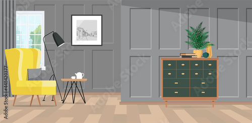 A spacious room with gray classic paneling and a bright yellow armchair by the window.