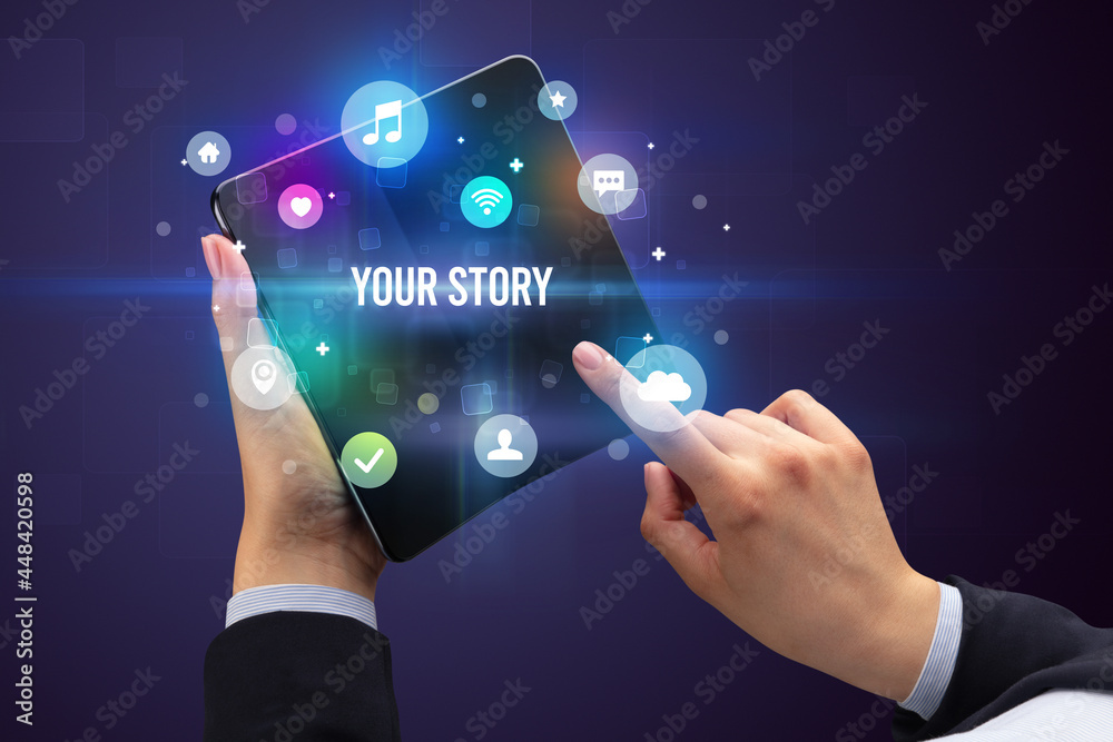 Businessman holding a foldable smartphone Businessman holding a foldable smartphone
