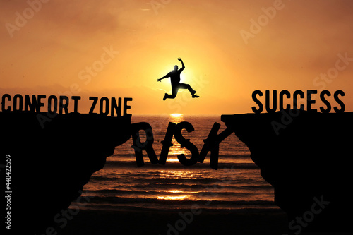 Man taking A Risk and Jumping Over the Cliff To Leave his Comfort zone Forward Success. Business Risk, challenge and success concept  photo