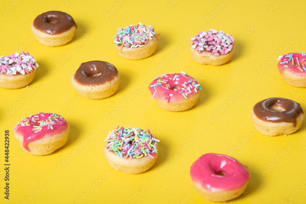 mini donuts with icing and sprinkles
