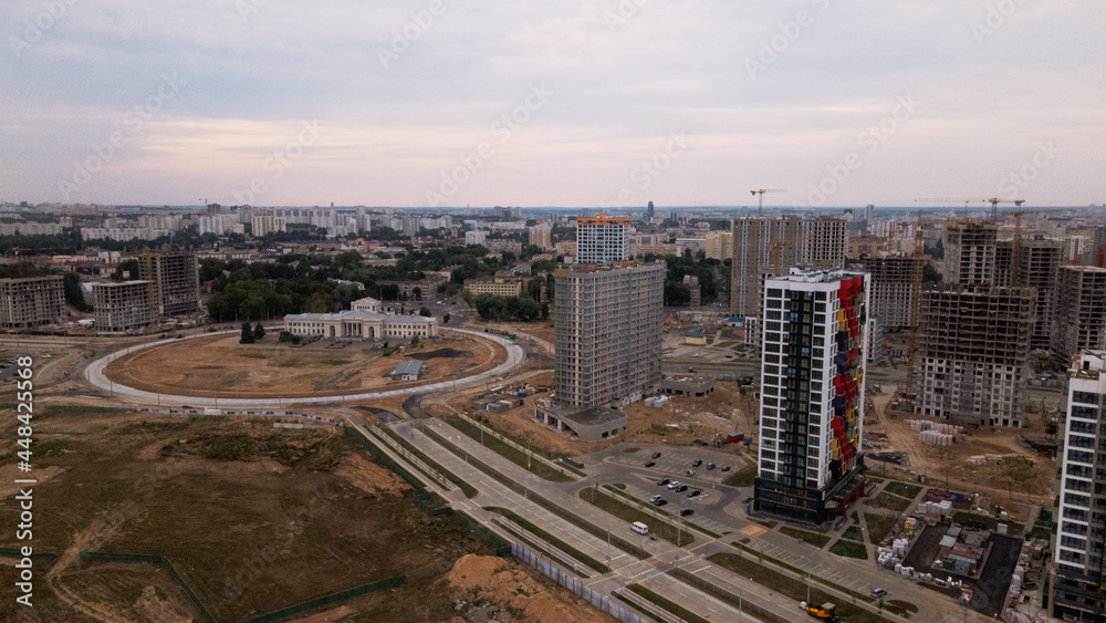 Obraz premium Construction site for a new city block. Construction work is underway. The constructed buildings are visible. Aerial photography.