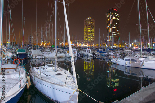 Photography Night view of Port Olimpic harbor and marina in Olympic village(Vila Olimpica) in Barcelona