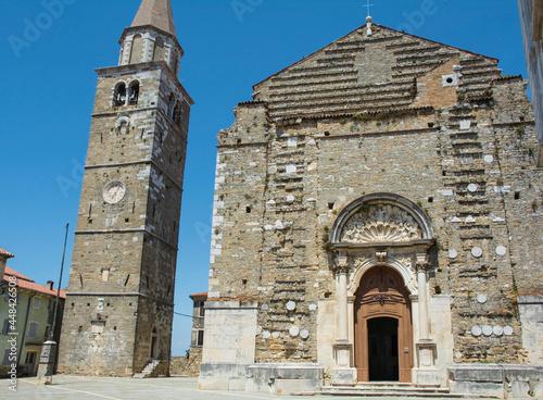 Crkva Sv Servula, St Servulus church, in Trg Sv Servula square in the historic medieval village of Buje in Istria, Croatia. The 16th century parish church has an unfinished Baroque facade and a Romane photo