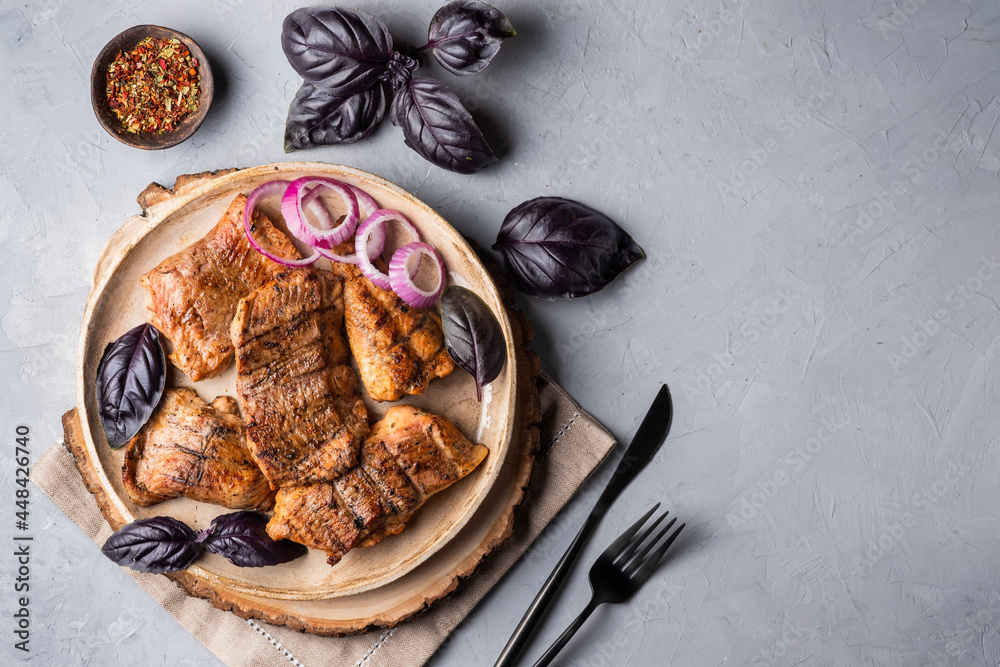Catfish kebab. Shashlik with roasted fish on on a round plate with red onion and basil. Catfish kebab. Shashlik with roasted fish on on a round plate with red onion and basil.