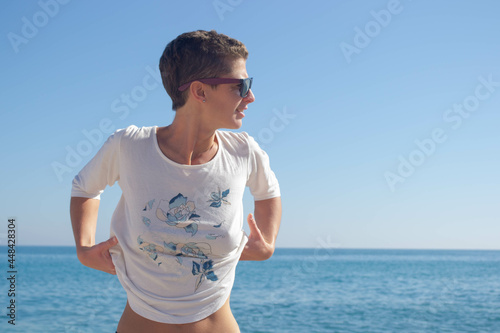 Woman posing on the beach.
