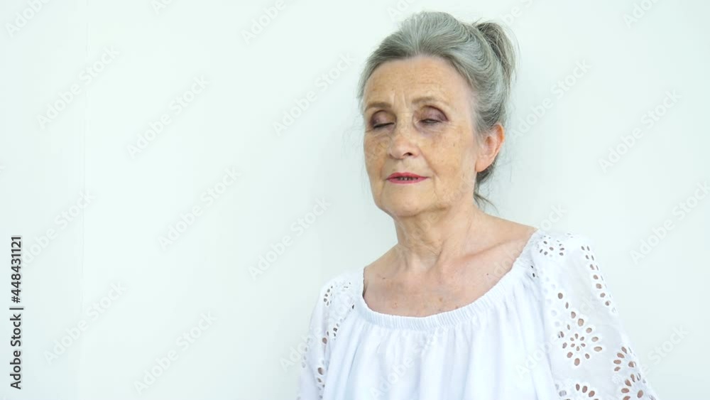 Closeup portrait, angry upset senior mature woman is raising her fist. Negative emotion, facial expression, feeling Closeup portrait, angry upset senior mature woman is raising her fist. Negative emotion, facial expression, feeling