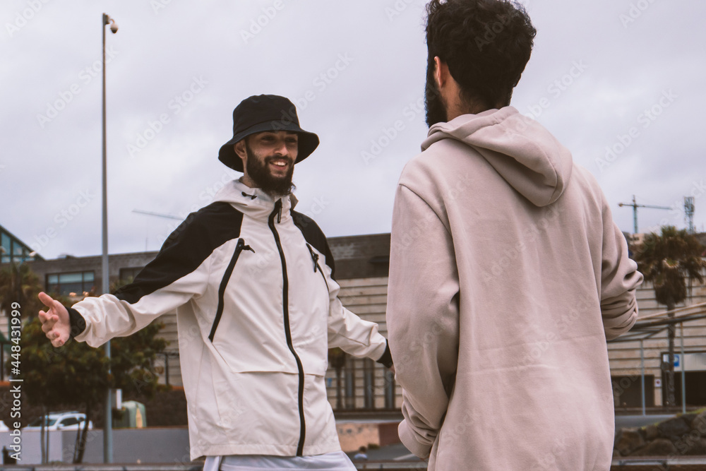 Two Caucasian friends talking after meeting Two Caucasian friends talking after meeting