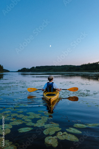 kayaking in sea in finland summer night time kayaking on a kayak summer holiday Fototapet