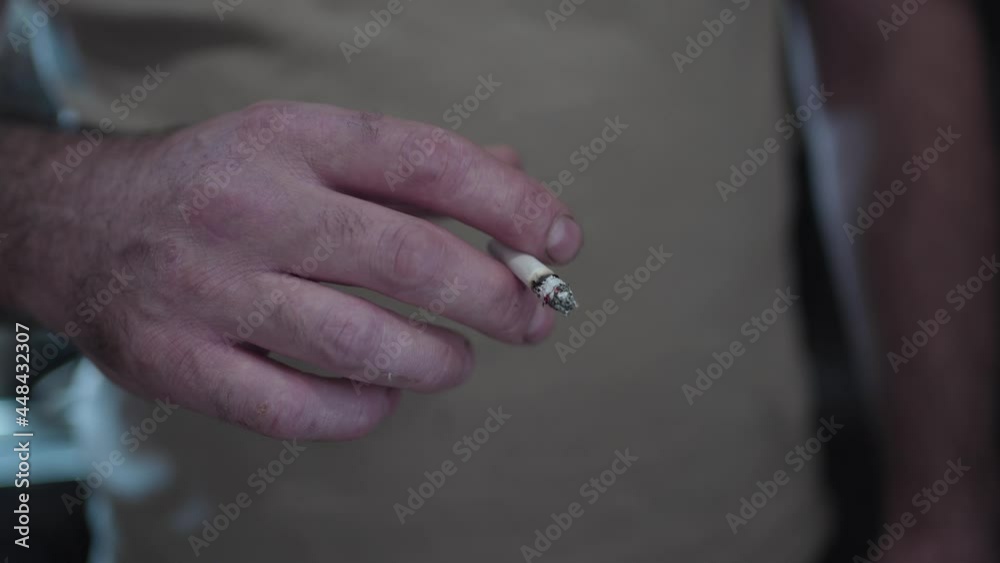 Trembling Hand Holding a Cigarette Closeup Trembling Hand Holding a Cigarette Closeup