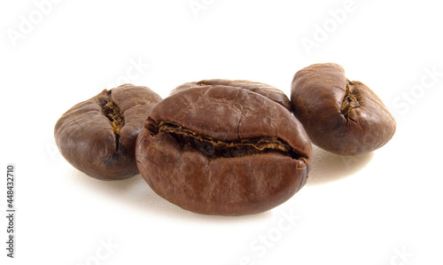 Arabica coffee beans close up isolated on white background.