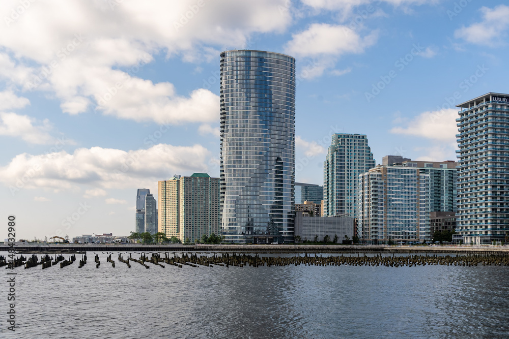 Jersey City, NJ - USA - July 30, 2021:  Horizontal view of Jersey City's Newport riverfront neighborhood, featuring the The Ellipse Apartments