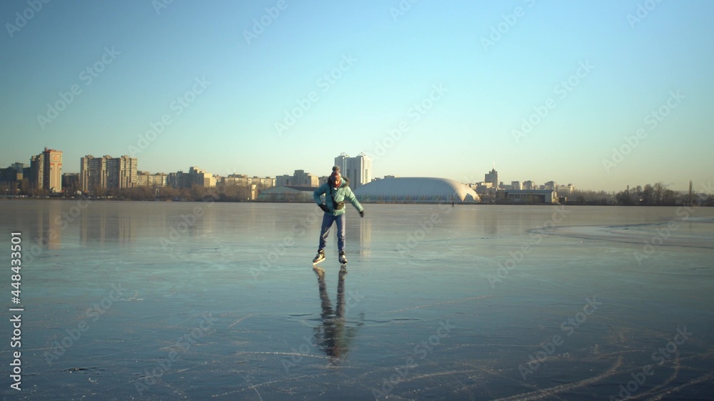 Adult woman shoots smartphone panorama on ice