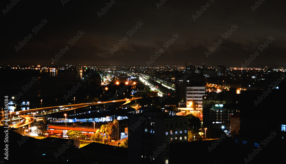 Panorama of Porto Alegre city's entrance in the evening, and and the lights across the cityscape, southern Brazil.