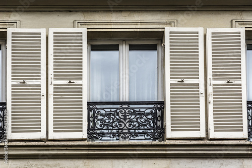 Traditional French old house with typical balconies and windows. Paris  France.