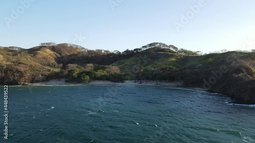 sunset over stunning hidden beach Costa Rica Beautiful Poor Man's Beach Guanacaste  photo