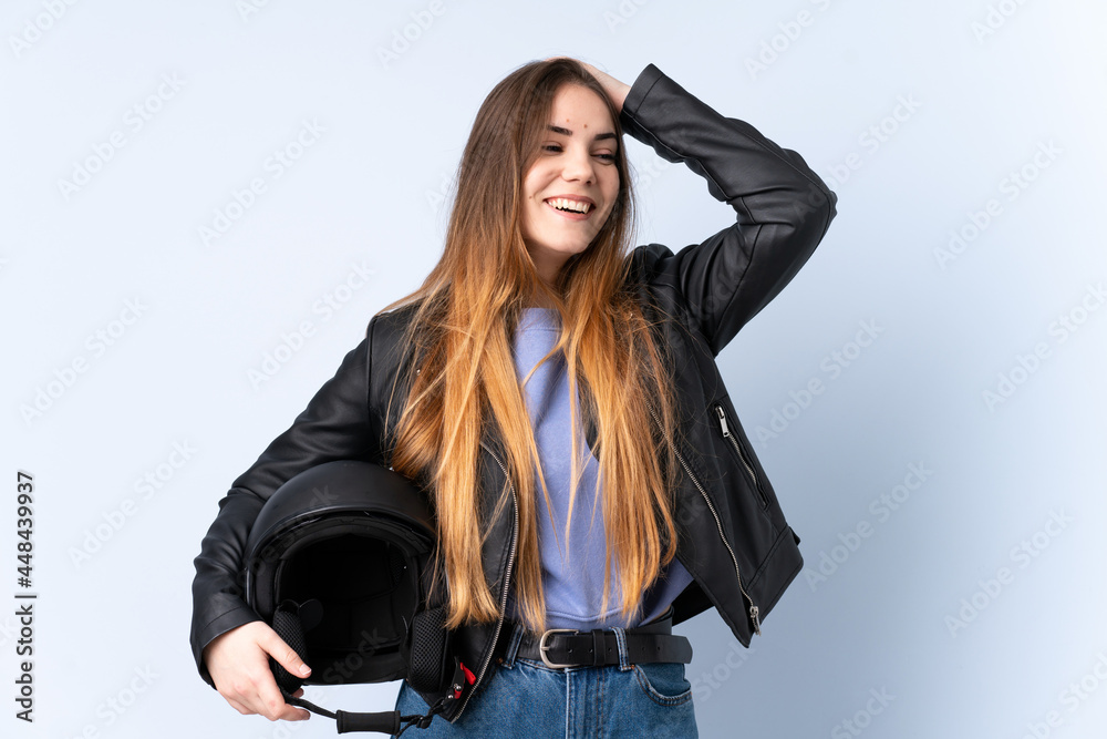 Woman with a motorcycle helmet laughing Woman with a motorcycle helmet laughing