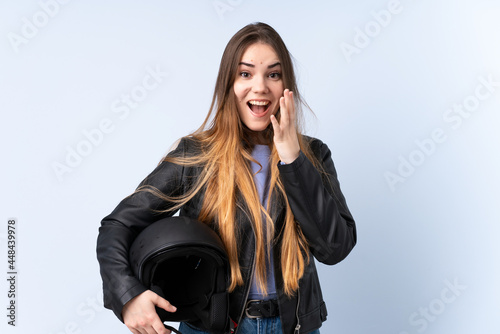 Woman with a motorcycle helmet with surprise facial expression