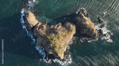 Aerial top shot over rocky islands sunset montosa Costa Rica guanacaste windy day clear water photo