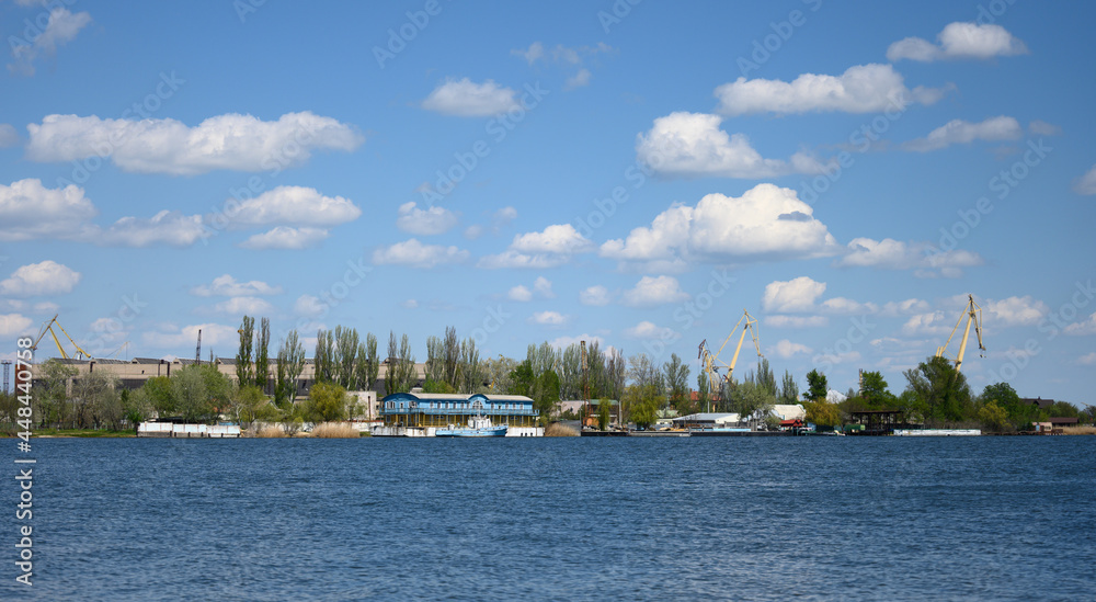 view of the river port with landing stage and cranes on a summer day. Kherson Ukraine