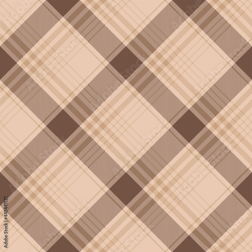 Brown and beige argyle tartan plaid. Pattern close-up for textile, paper and other prints.