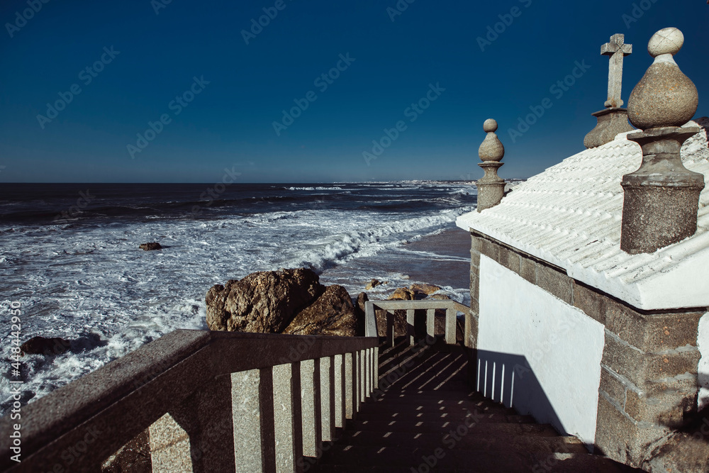 View of the Atlantic Ocean from Chapel Senhor da Pedra on Praia de Miramar, Vila Nova de Gaia, Portugal.