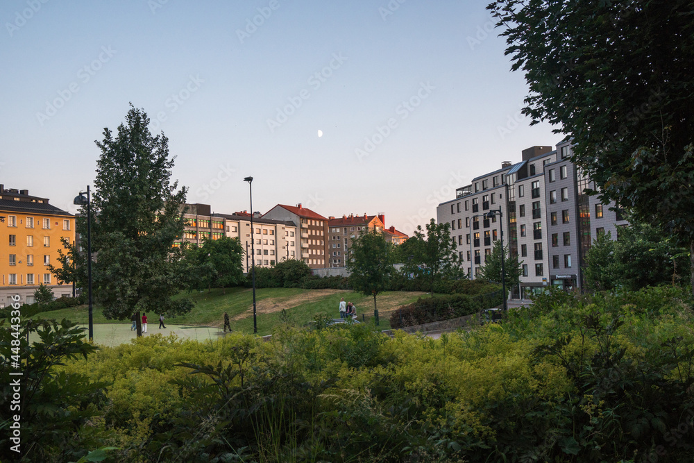 Helsinki, Finland - July 18th 2021: scandinavian buildings and a park in Helsinki duing warm season