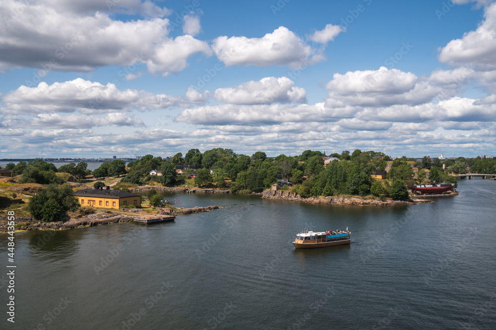 Helsinki, Finland - July 18th 2021: View of the Helsinki harbour, marina bay in the background, and Sveaborg island, view from top of a cruise ship