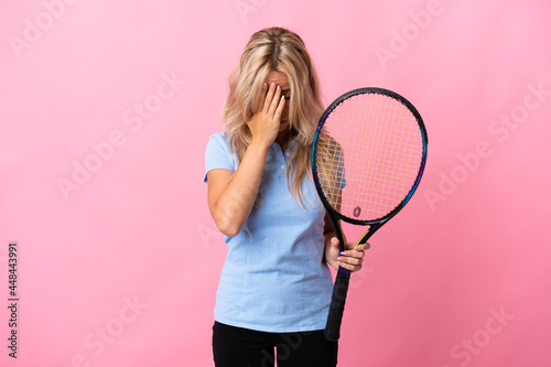Young Russian woman playing tennis isolated on purple background with tired and sick expression © luismolinero