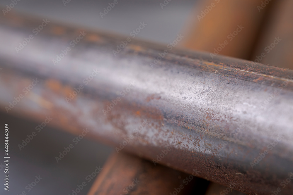 Background of fragments of rusted metal pipes close-up. Industrial abstract background. Background of fragments of rusted metal pipes close-up. Industrial abstract background.