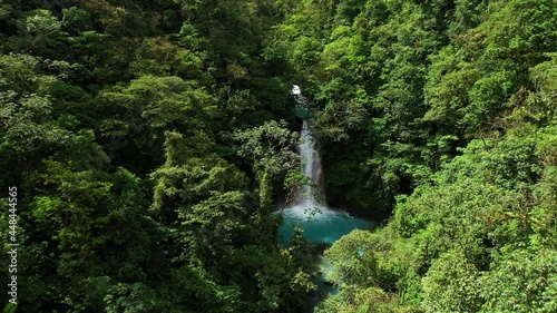 Aerial shot of Rio celeste waterfall natural blue water river tropical touristic bucket list  photo