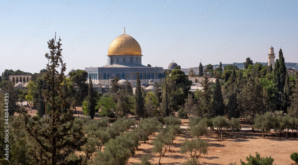 Islamic shrine the Dome of the Rock, on Temple Mount in Jerusalem Old City. UNESCO World Heritage Site, Jerusalem's most recognizable landmark. Olive trees on the foreground.