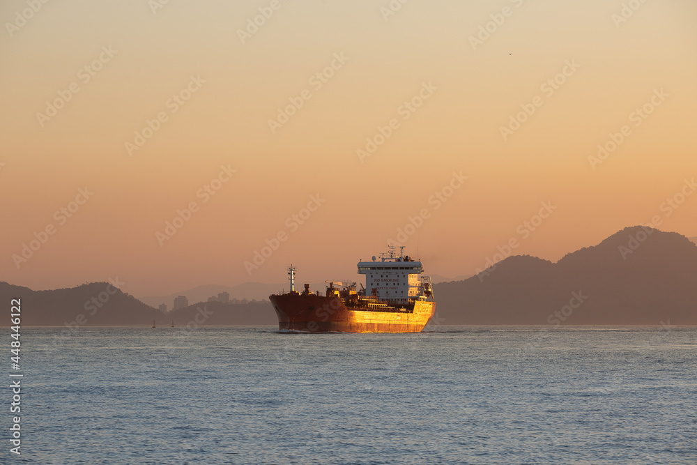 Freighter entering the Port of Santos, Brazil, during sunset