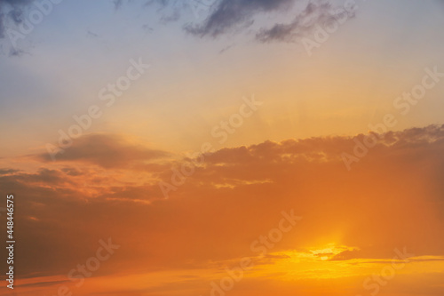 evening sky with clouds and rays of the sun  background