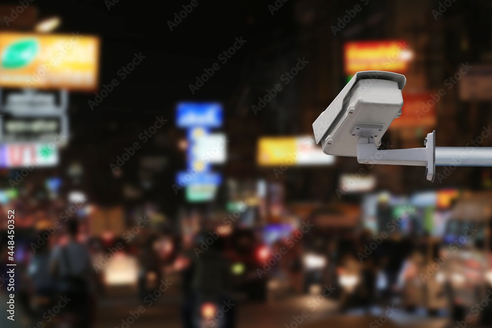 Obraz premium CCTV system on blur road at night background.