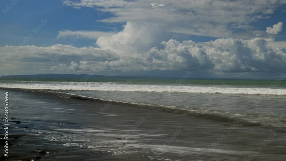 Time lapse of waves with surfers Golfe dulce pavones Costa Rica Corcovado in background Time lapse of waves with surfers Golfe dulce pavones Costa Rica Corcovado in background
