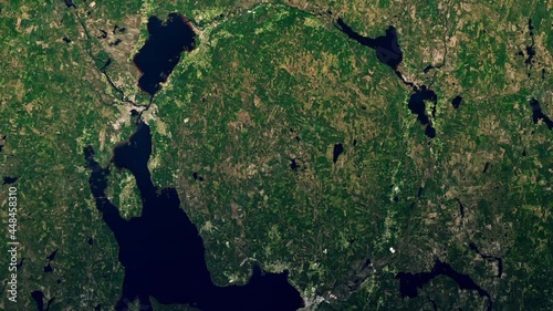 Sign of ancient asteroid impact on earth aerial satellite view, Siljan lake ring in Sweden sunrise scenic animation. Based on images furnished by Nasa photo