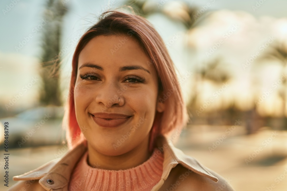 Young hispanic girl smiling happy standing at the city. Young hispanic girl smiling happy standing at the city.