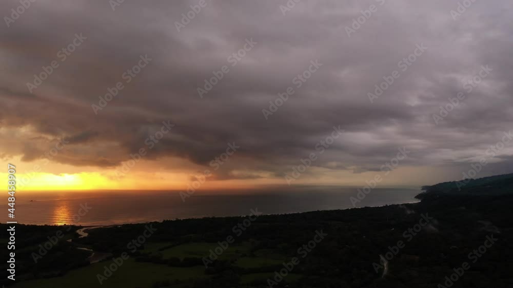 Stormy fire sky sunset over playa hermosa Costa Rica next to Uvita tropical paradise