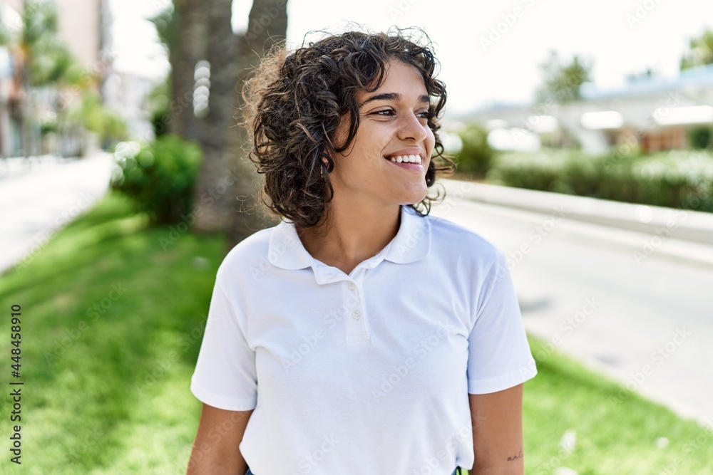 Young latin girl smiling happy standing at the city. Young latin girl smiling happy standing at the city.