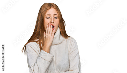 Young irish woman wearing casual winter sweater bored yawning tired covering mouth with hand. restless and sleepiness.