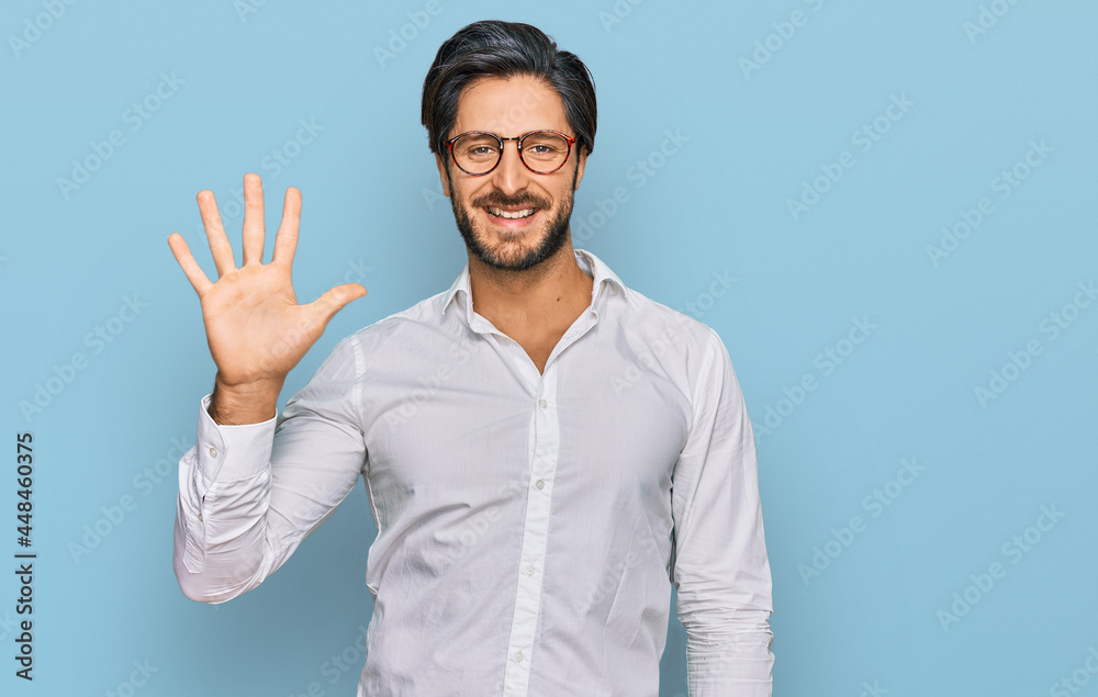 Young hispanic man wearing business shirt and glasses showing and pointing up with fingers number five while smiling confident and happy. Young hispanic man wearing business shirt and glasses showing and pointing up with fingers number five while smiling confident and happy.
