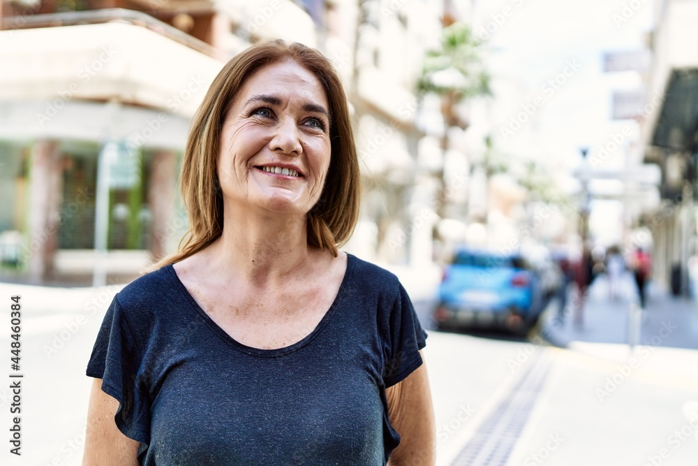 Middle age hispanic woman smiling happy outdoors on a sunny day Middle age hispanic woman smiling happy outdoors on a sunny day