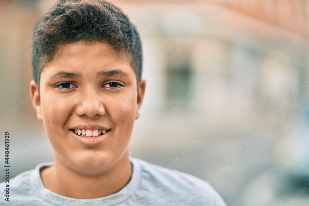 Adorable latin boy smiling happy standing at the city. Adorable latin boy smiling happy standing at the city.
