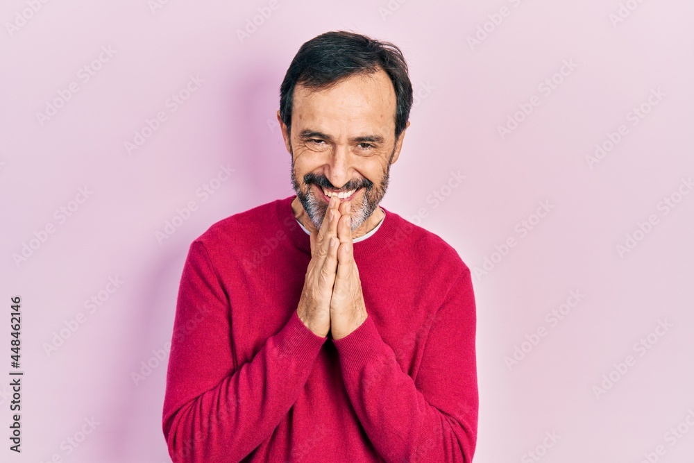 Middle age hispanic man wearing casual clothes praying with hands together asking for forgiveness smiling confident. Middle age hispanic man wearing casual clothes praying with hands together asking for forgiveness smiling confident.