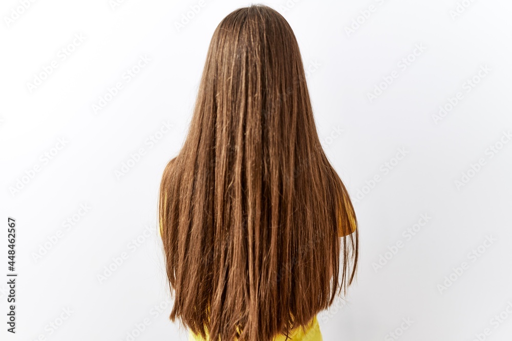 Naklejka premium Young brunette teenager standing together over isolated background standing backwards looking away with crossed arms