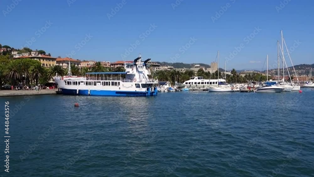 Panoramic view of a tourist port and its boats in italy, on a sunny day Panoramic view of a tourist port and its boats in italy, on a sunny day