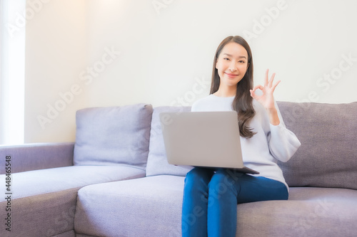 Portrait beautiful young asian woman use laptop for working