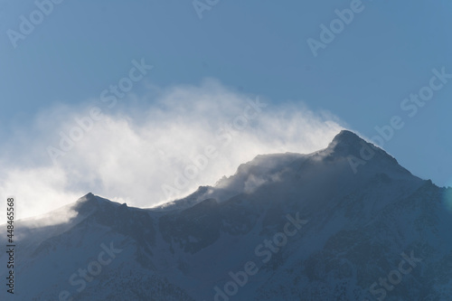 Snow and Wind on mountain peaks, Lone Pine Desert, California © Neil