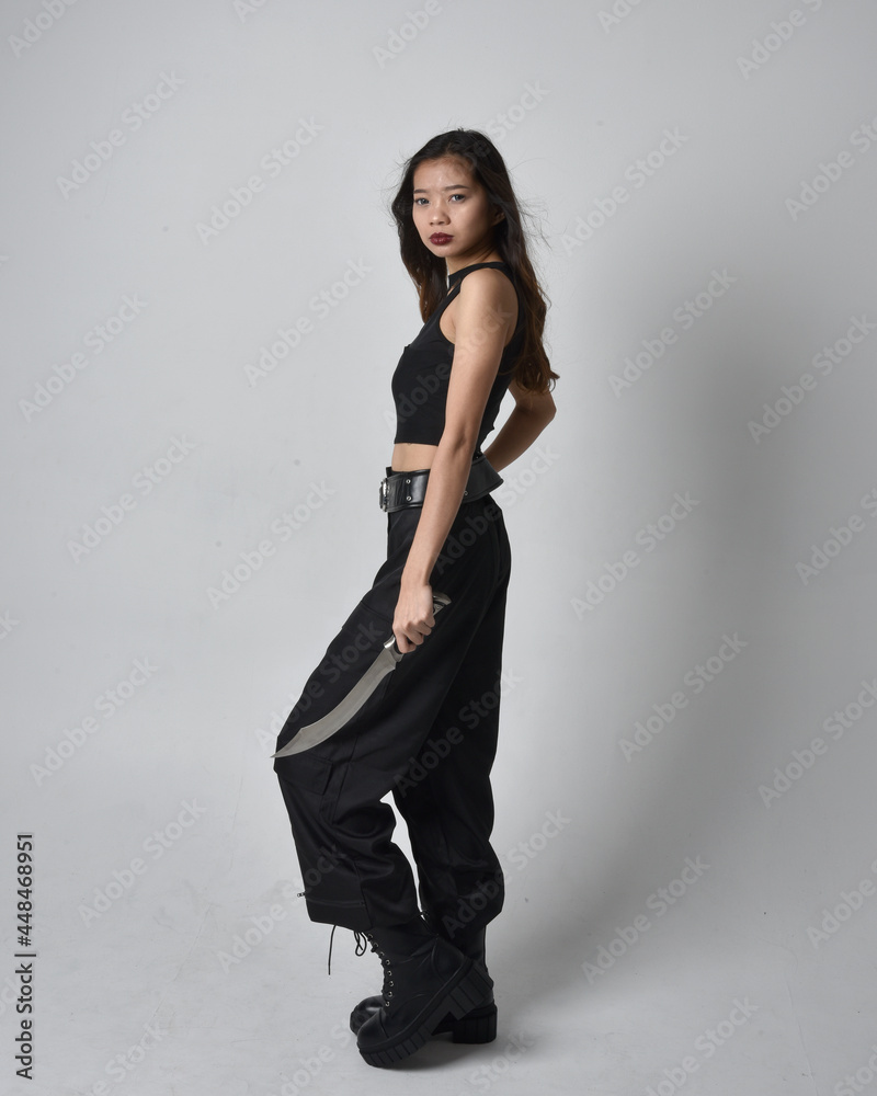 Full length portrait of pretty young asian girl wearing black tank top ...